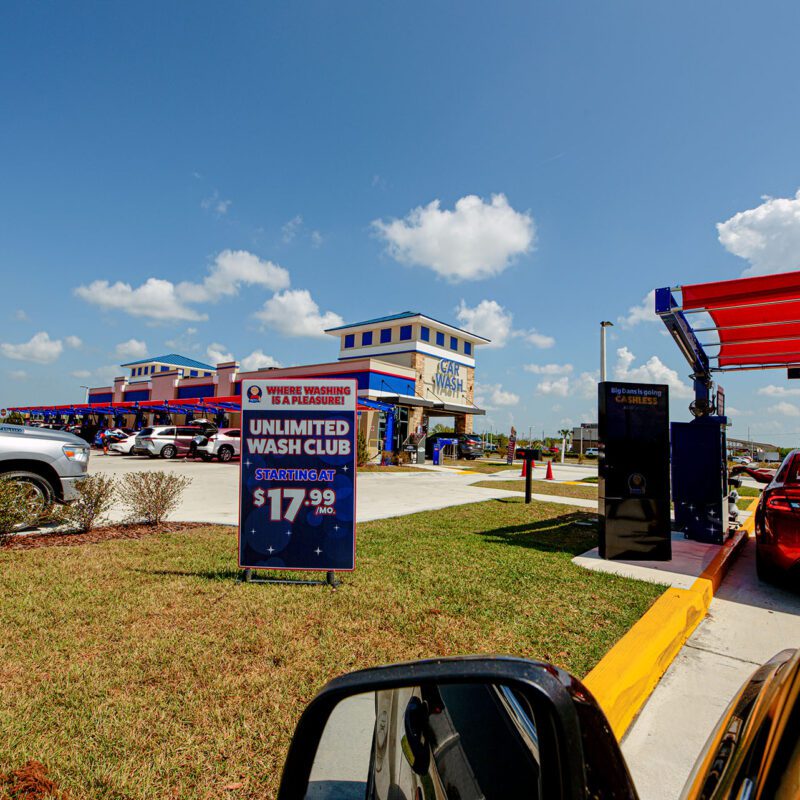 Driver's seat view of the line for Big Dan's soft-touch automatic car wash in Lakewood Ranch, FL