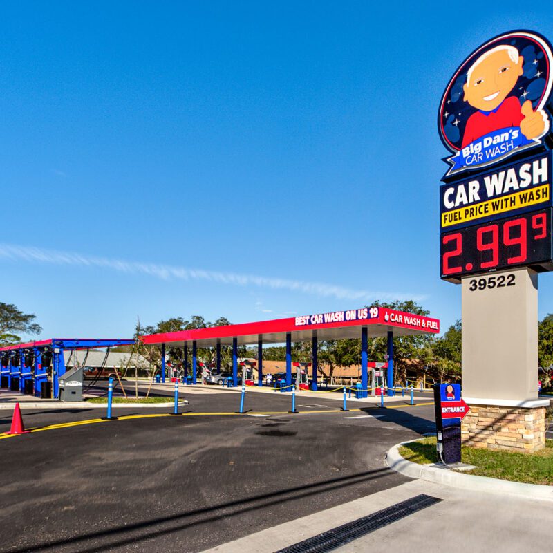 exterior view of Big Dan's Car Wash lot in Tarpon Springs, FL, featuring the self-service car wash station and Big Dan's sign