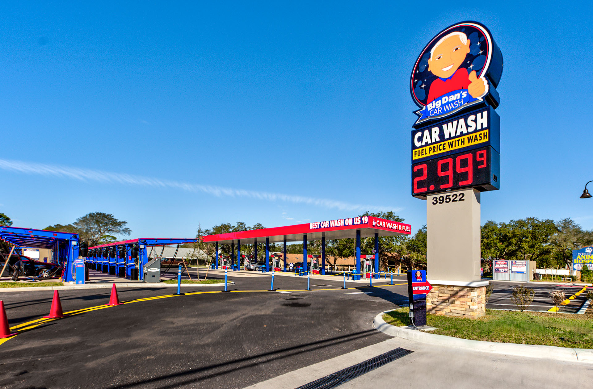exterior view of Big Dan's Car Wash lot in Tarpon Springs, FL, featuring the self-service car wash station and Big Dan's sign